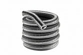A coiled length of flexible, corrugated preinsulated 316 stainless steel chimney liner. The shiny metallic tubing is stacked in several circular loops against a plain white background, with one open hollow end resting on top and facing forward